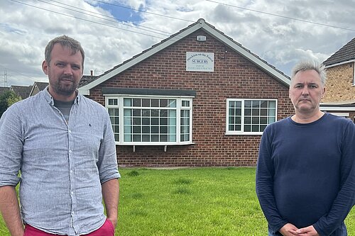 Councillors Andrew Hollyer and Paul Healey outside the Stockton-on-the-Forest GP surgery