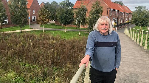 Cllr Tony Fisher on a pedestrian bridge