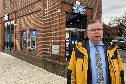 Picture of Councillor Waller standing outside Acomb Halifax Bank