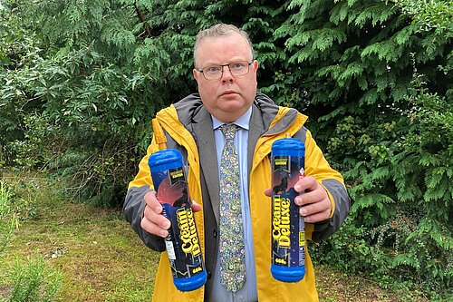 Councillor Andrew Waller with two Nitrous Oxide cannisters